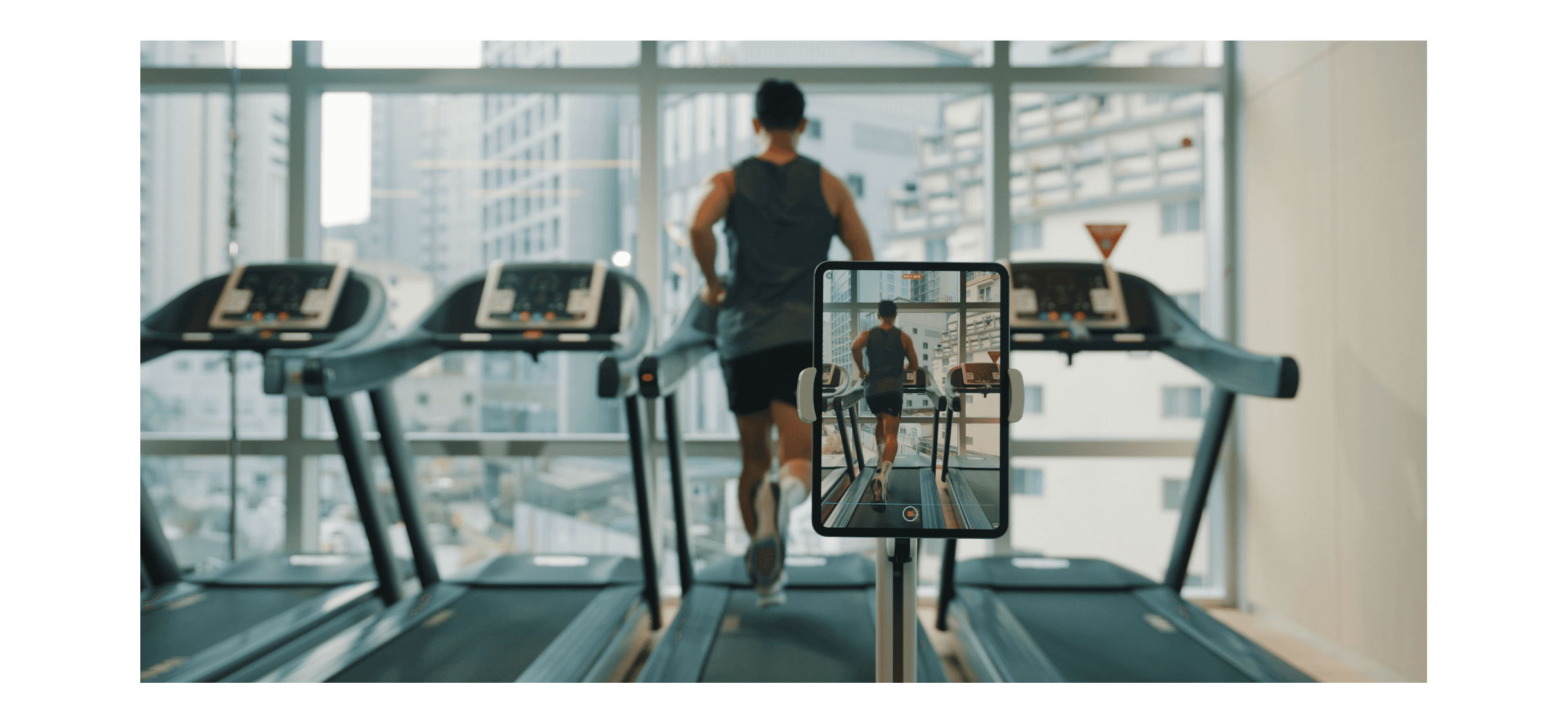 A tablet recording a runner’s form on a treadmill