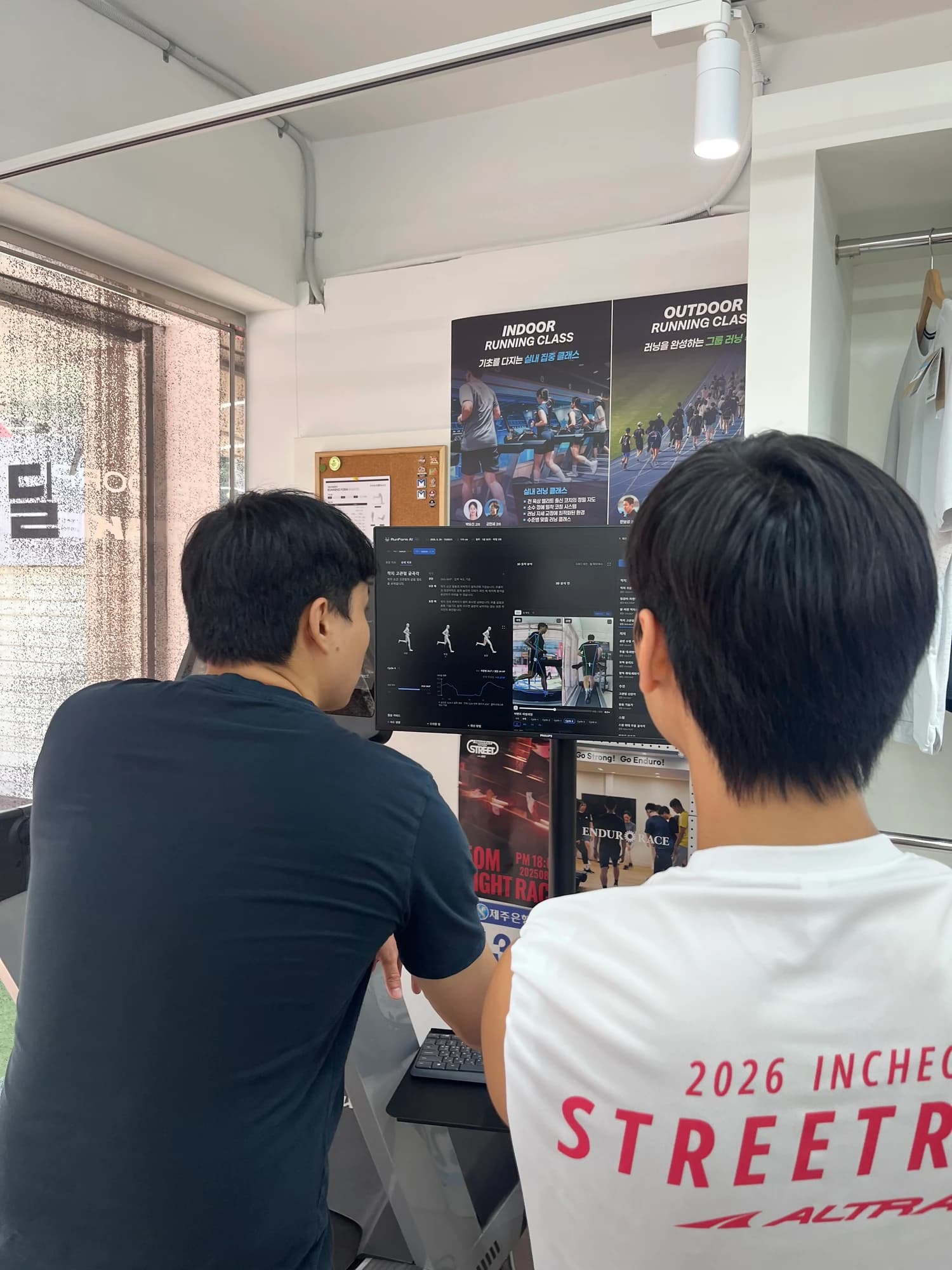 A coach and runner review video and analysis metrics in RunForm AI Pro