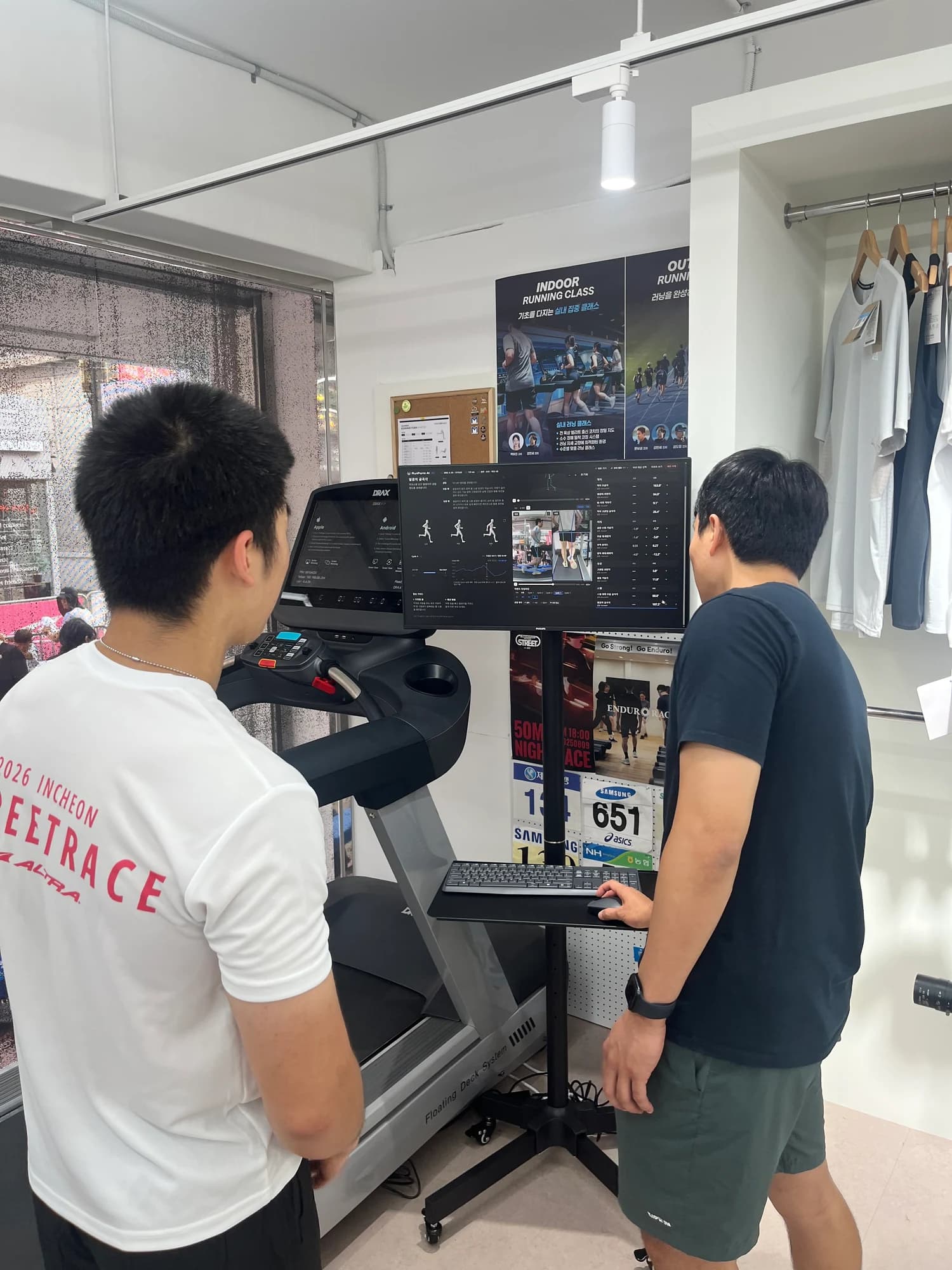 A coach and runner review running video and joint motion analysis together